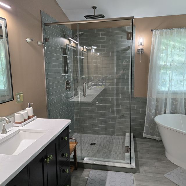 Custom glass shower enclosure installed by Battlefield Glass