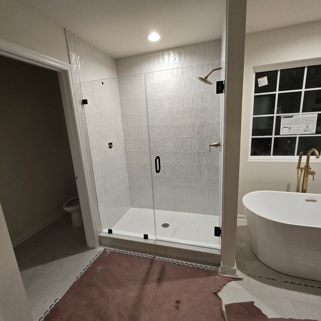 Custom glass shower enclosure installed by Battlefield Glass