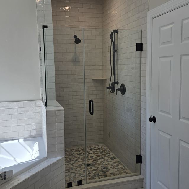 Custom glass shower enclosure installed by Battlefield Glass