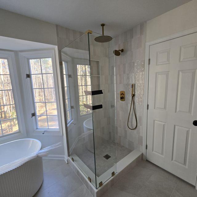 Custom glass shower enclosure installed by Battlefield Glass