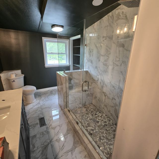 Custom glass shower enclosure installed by Battlefield Glass
