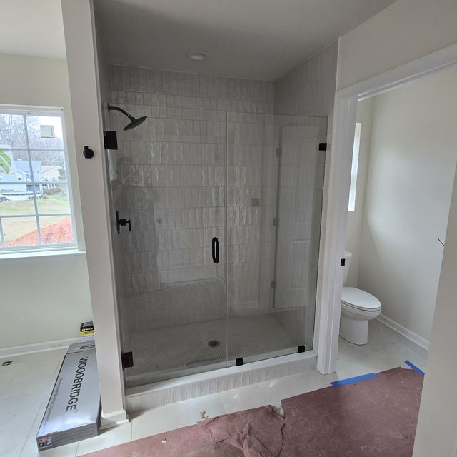 Custom glass shower enclosure installed by Battlefield Glass