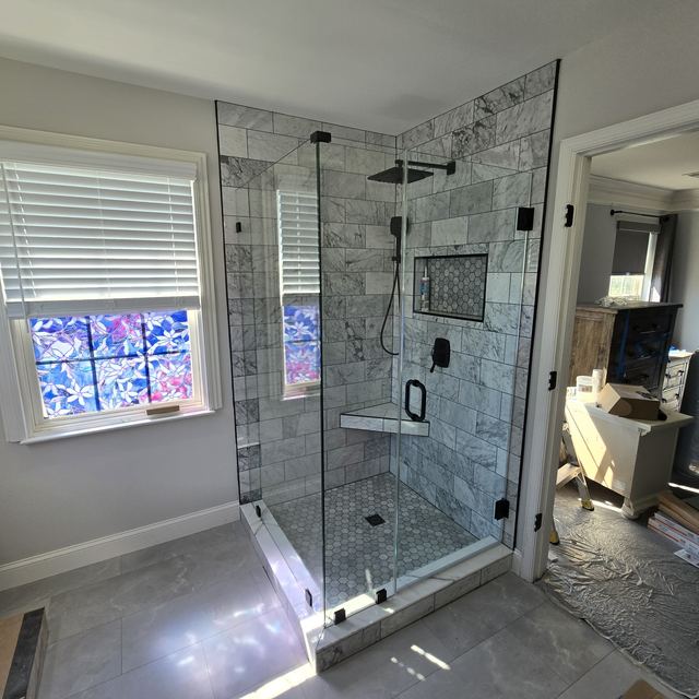 Custom glass shower enclosure installed by Battlefield Glass