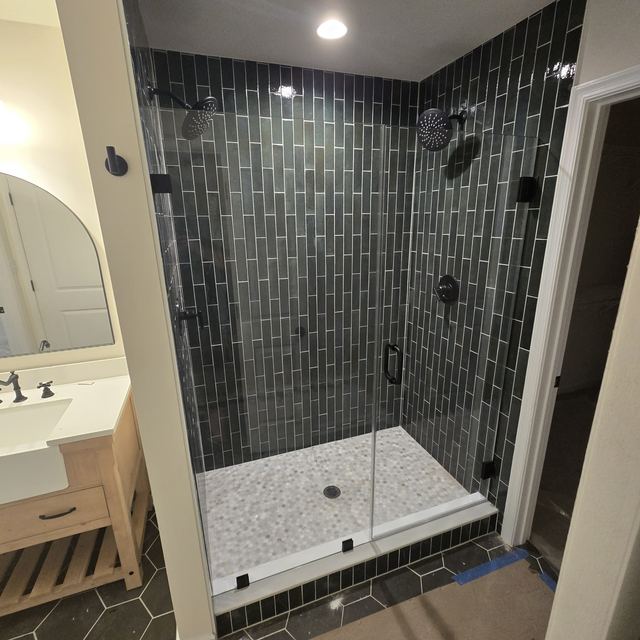 Custom glass shower enclosure installed by Battlefield Glass
