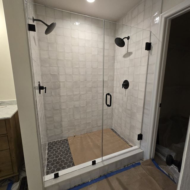 Custom glass shower enclosure installed by Battlefield Glass
