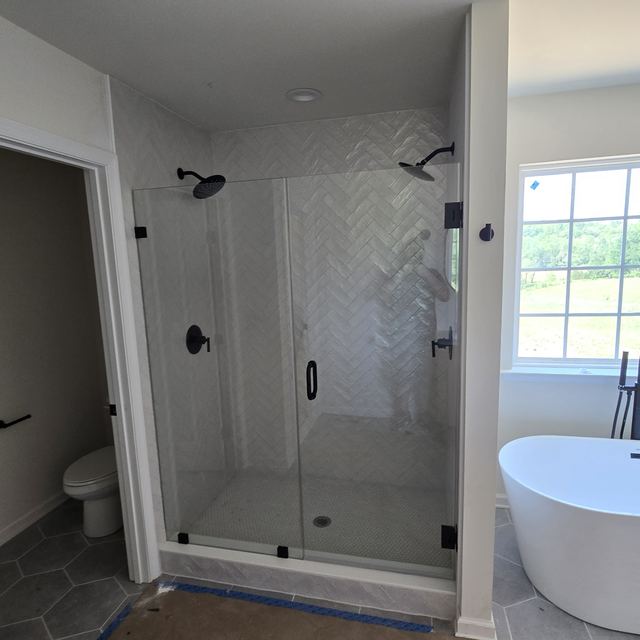 Custom glass shower enclosure installed by Battlefield Glass