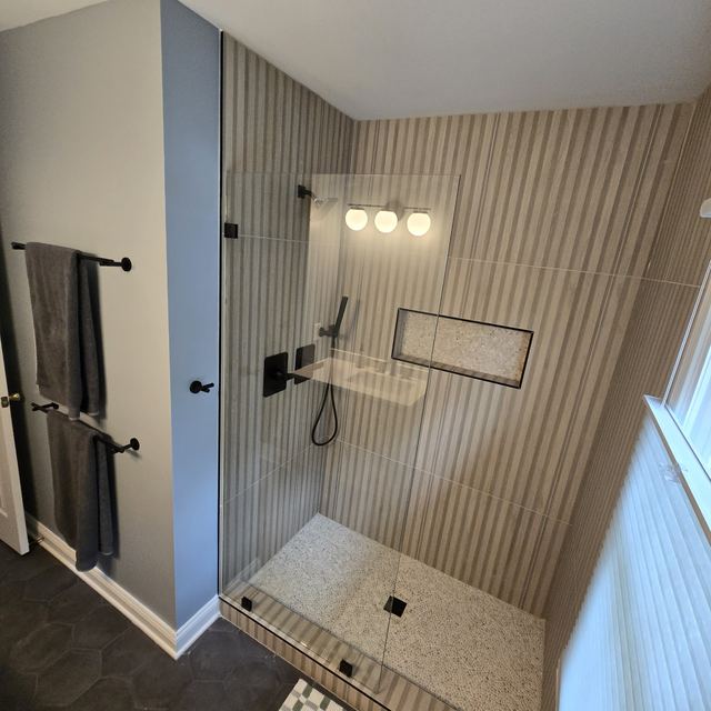 Custom glass shower enclosure installed by Battlefield Glass
