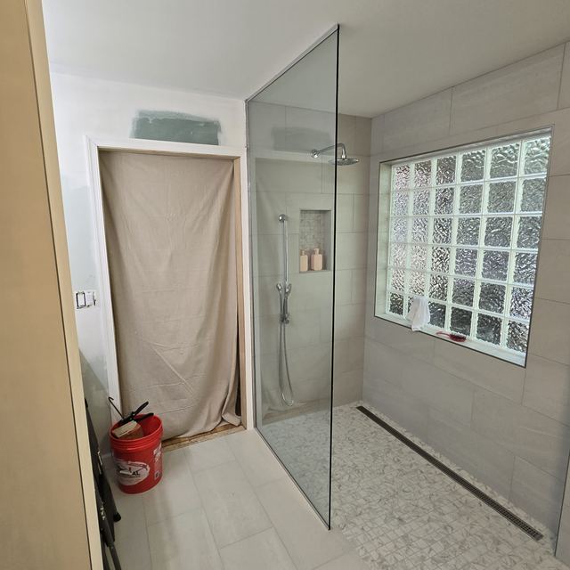 Custom glass shower enclosure installed by Battlefield Glass