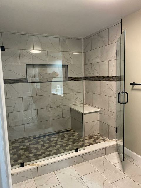 Custom glass shower enclosure installed by Battlefield Glass